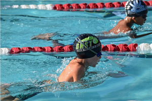 Two Young Boys Doing Swim Laps